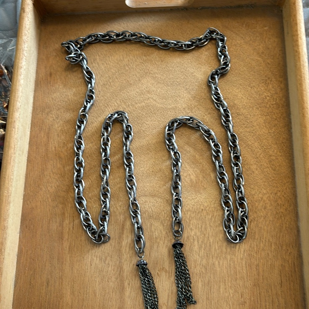 Silver tone chain belt with tassels. Tie design 60”